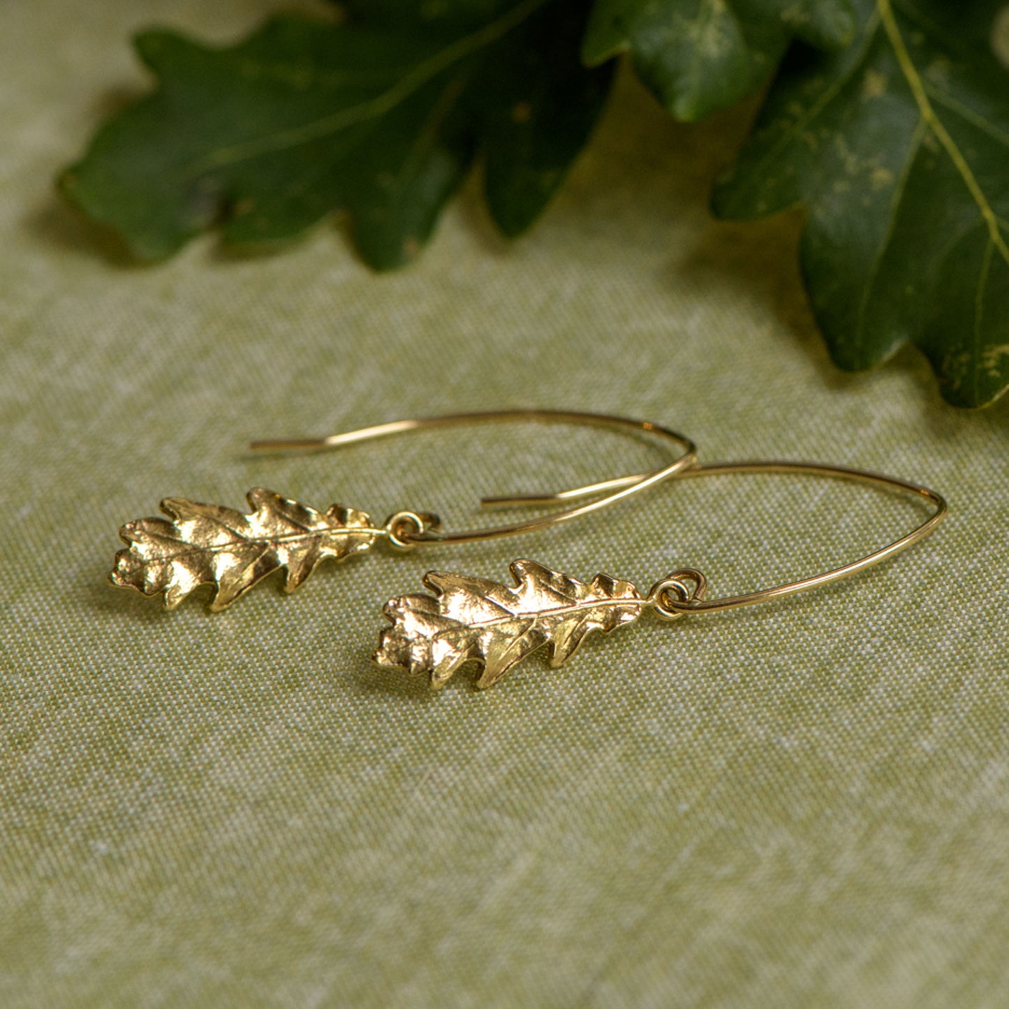 9ct gold oak leaf dainty drop earrings by Notion Jewellery