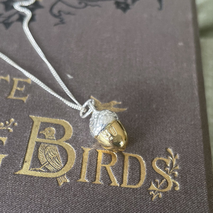 Small acorn pendant with 18ct gold vermeil nut, showing maker's mark and 925 stamp