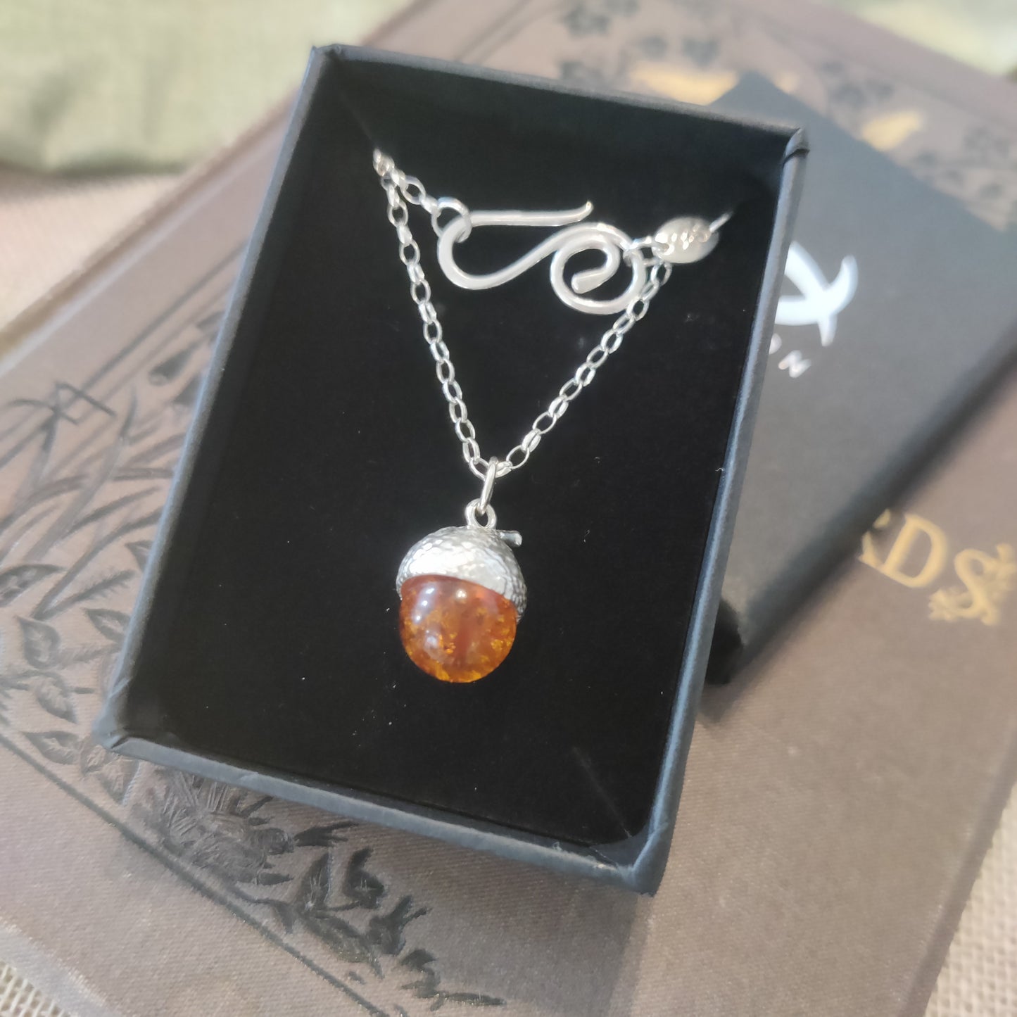 Large acorn and amber necklace in a gift box.
