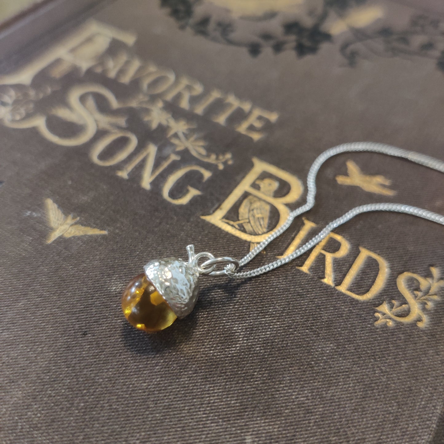 Delicate amber silver pendant by Notion Jewellery.