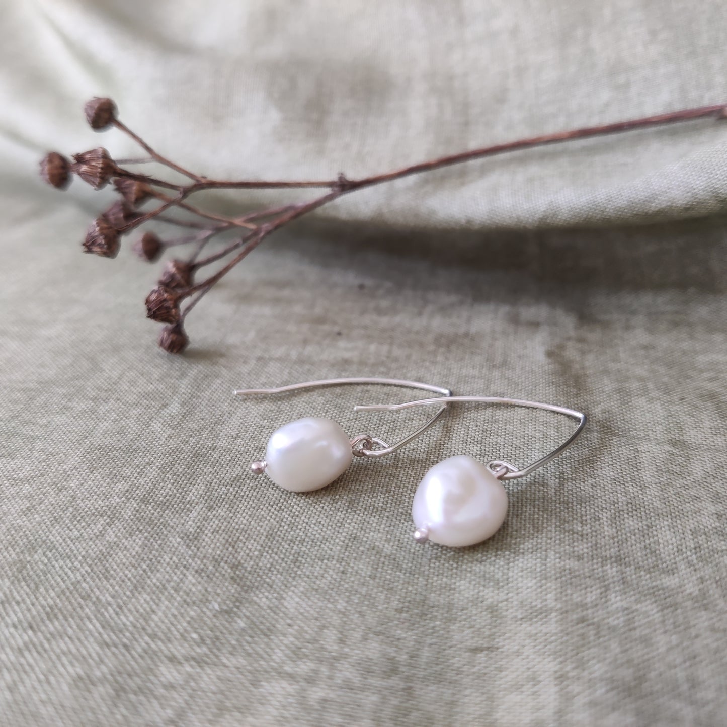 Delicate pearl earrings by Notion Jewellery