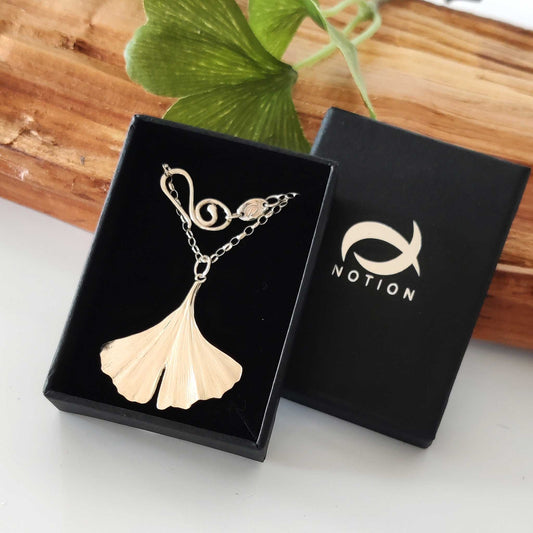 Large ginkgo necklace in sterling silver in a display box.
