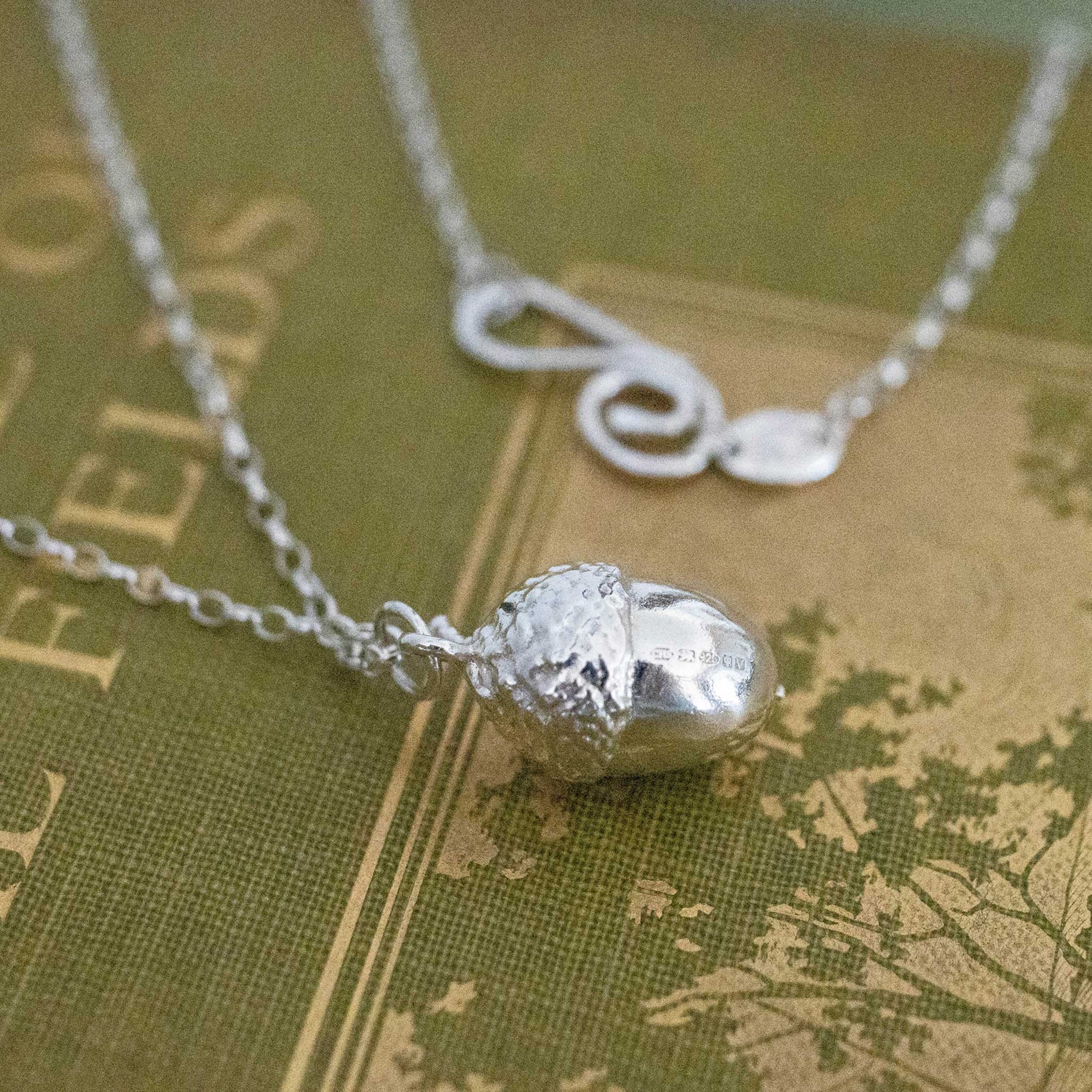 Sterling silver acorn with a hook clasp
