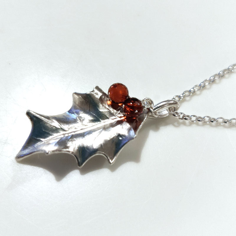 Medium silver holly leaf with Mozambique garnets