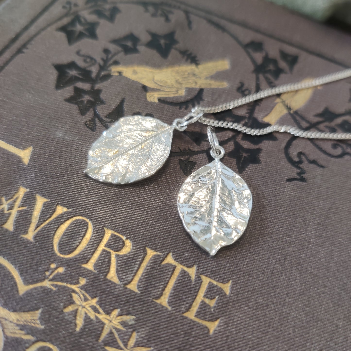 Double leaf pendant handcrafted from sterling silver