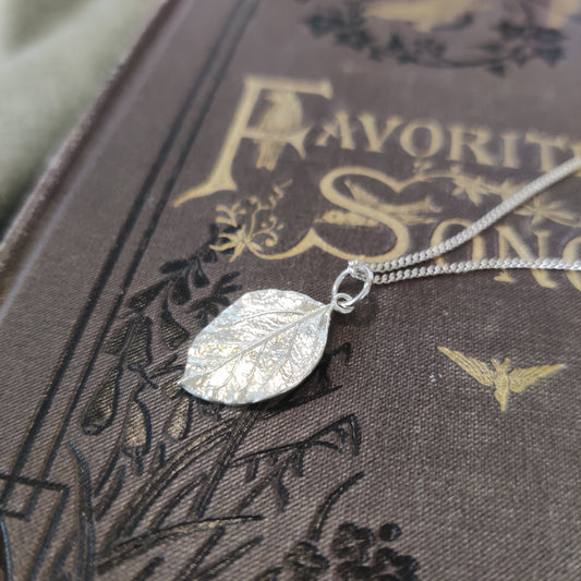 A delicate sterling silver leaf pendant 