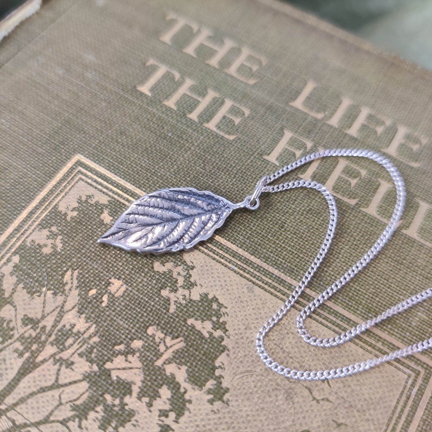Sterling silver autumn leaf charm necklace by Notion Jewellery
