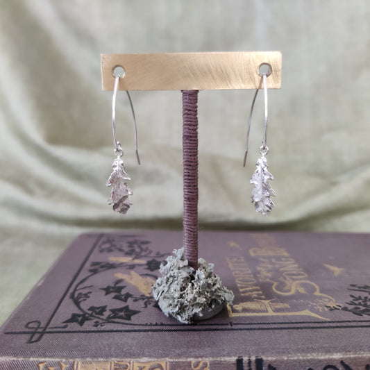 Handmade leaf earrings in 925 silver on a jewellery stand