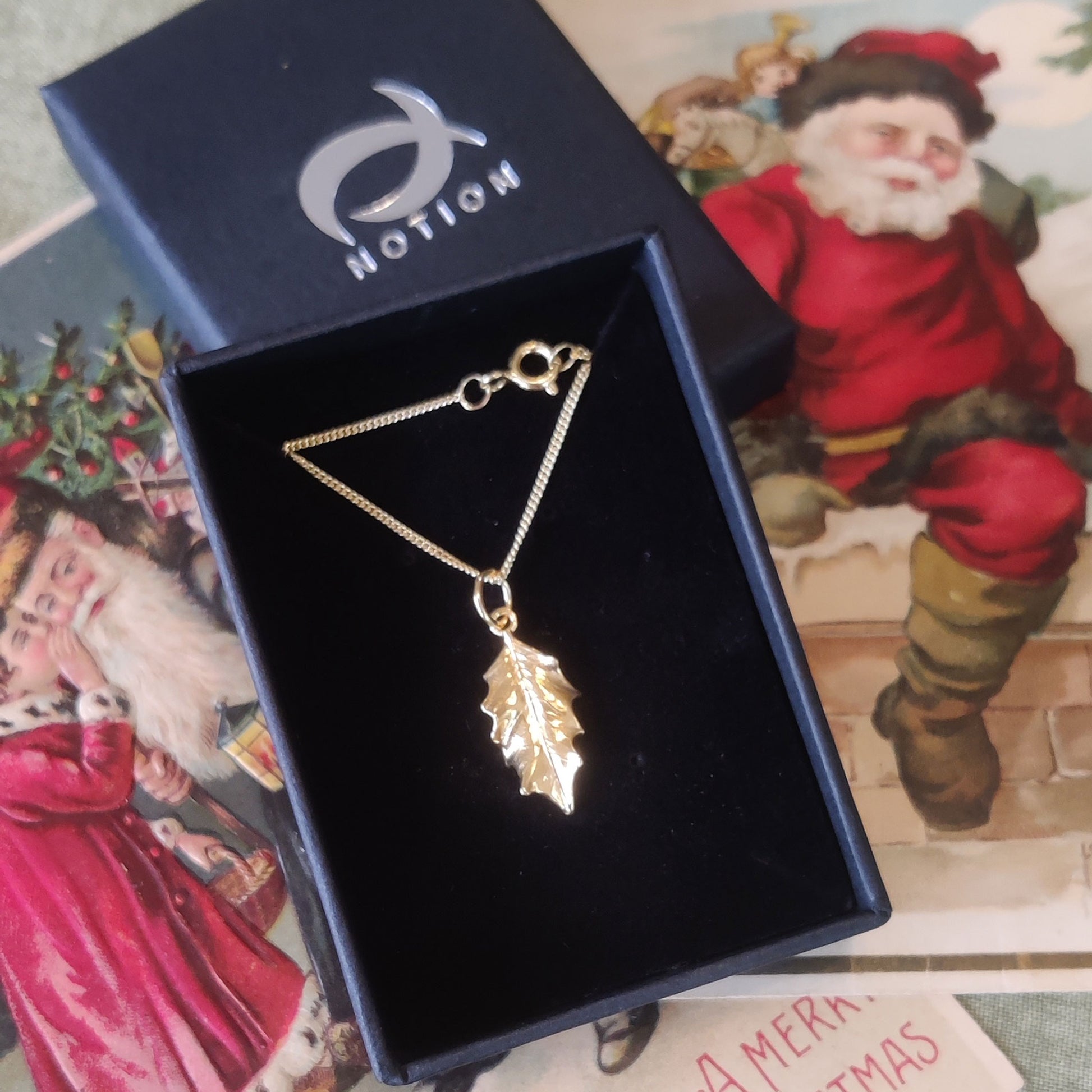 Woodland necklace cast from a holly leaf in 9ct yellow gold. 