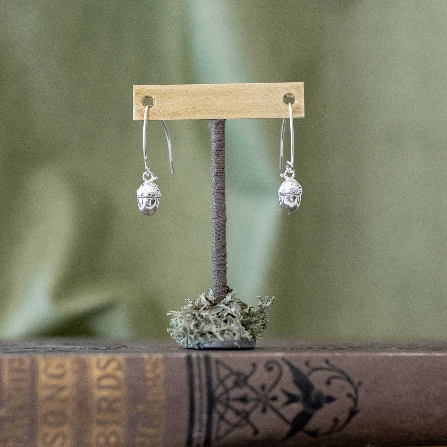 Acorn drop earrings on stand