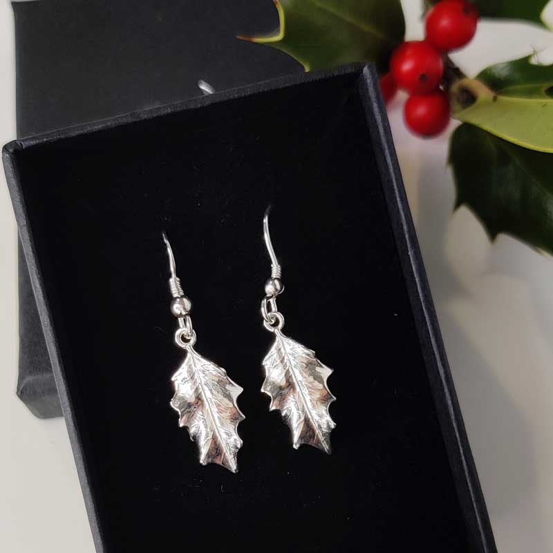 Silver holly drop earrings in box