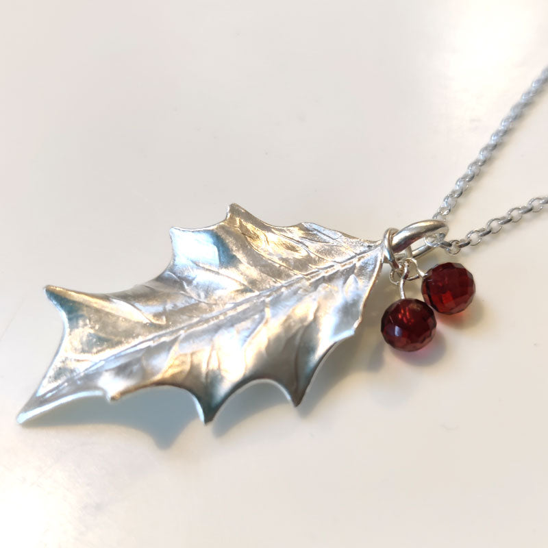 Large silver holly leaf with Mozambique garnets
