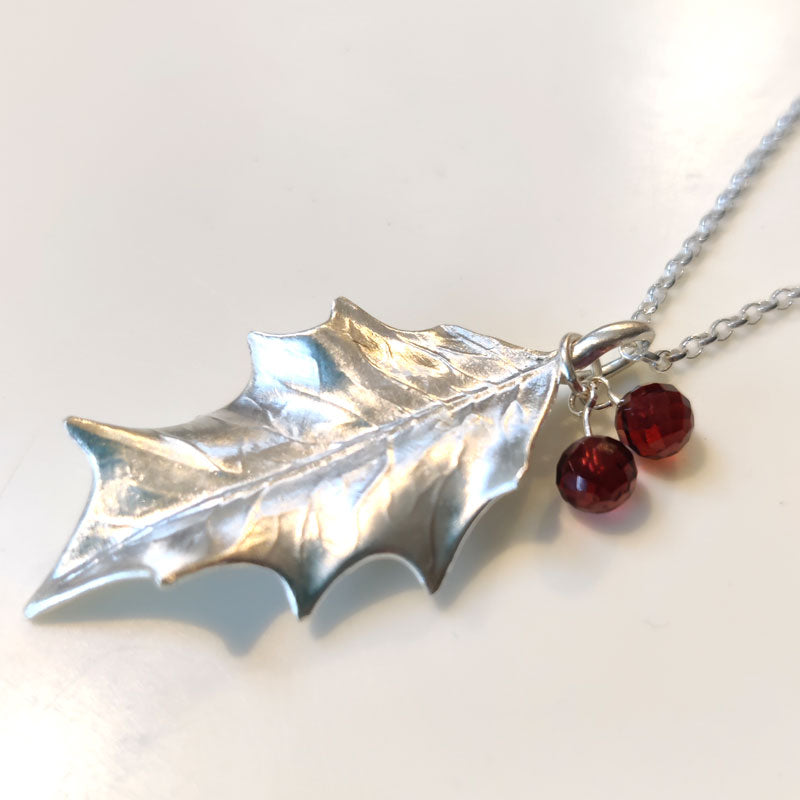 Large silver holly leaf with Mozambique garnets