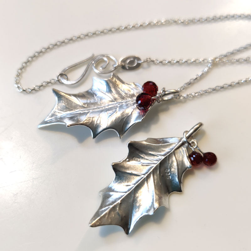 Large silver holly leaves with Mozambique garnets