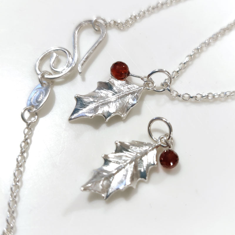 Tiny silver holly leaves with Mozambique garnets